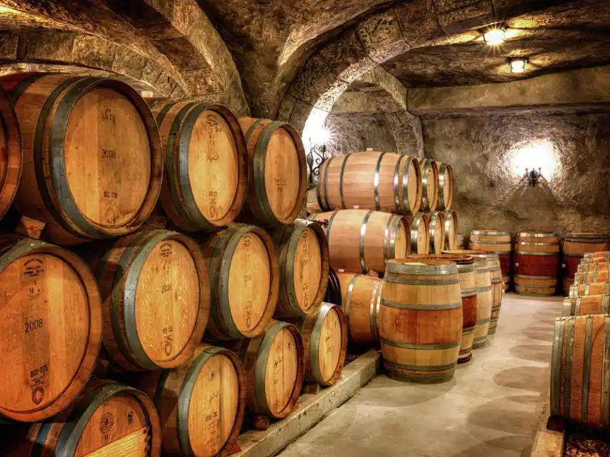 Oak barrels used for wine ageing in a cellar in La Rioja, Spain