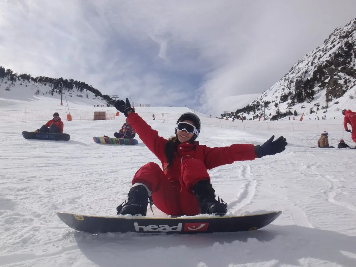 Snowboarder in a red onesie on the Pal Arinsal pistes